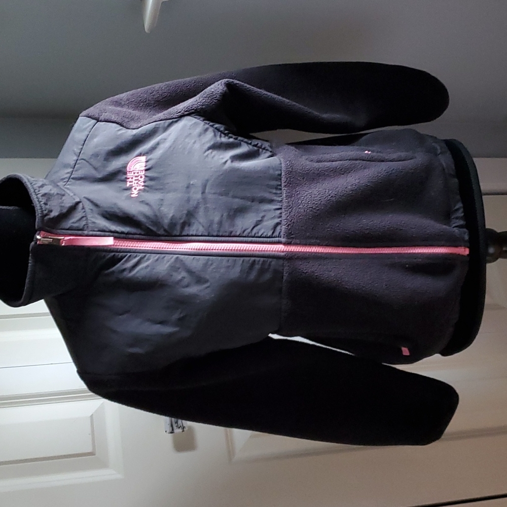 North Face black jacket with pink zippers.